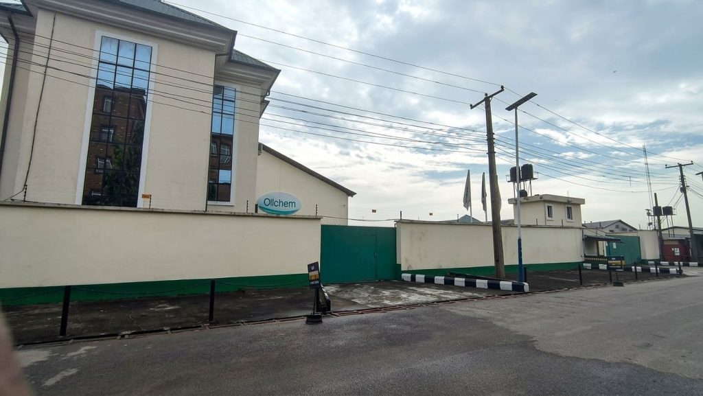 Oilchem office building, perimeter wall and green entrance gate