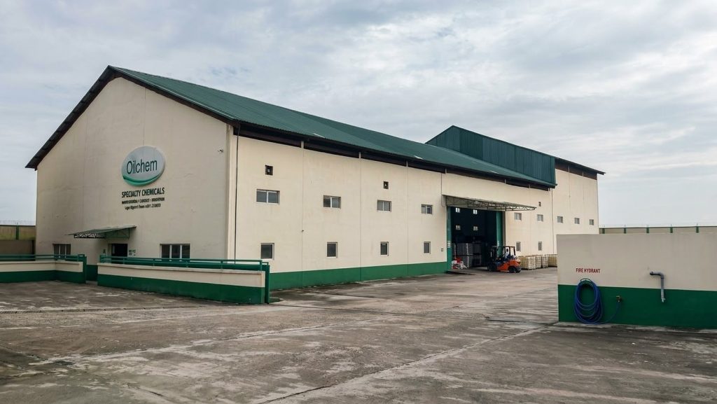 Large Oilchem Specialty Chemicals warehouse with a green roof